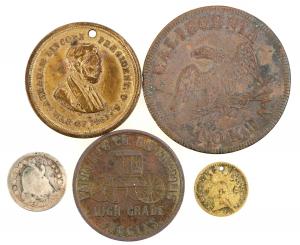 Group of five items, including an 1853 half dime, an Ohio Volunteers medal presented to Henry Ford, an 1849 California token with the American flag, and a tiny spiel mark ($1,438).