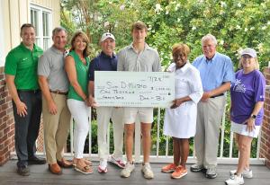 Photo of Samuel DiMuzio receiving check as the 2023 boys Dee Mack Scholarship Award Winner. His family is also in the picture along with several LowCountry Tennis Association Board Members.