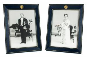 Pair of photos in the original Imperial frames of Emperor Hirohito and Empress Kōjun of Japan, boldly signed in Japanese calligraphy (est. $7,000-$8,000).