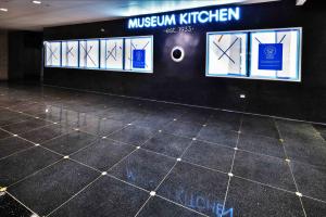 Square brass inserts are set in the intersections of terrazzo squares.