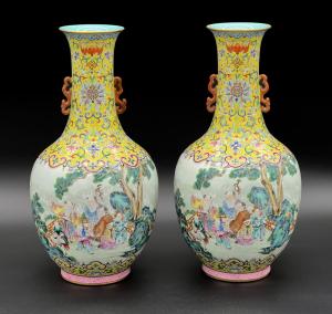 Pair of Chinese famille rose vases – possibly Jiaqing, early 19th century – having bodies with continuous landscapes of elders and children by the sea, 14 inches tall (est. $75,000-$150,000).