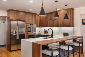 Custom remodeled kitchen and new peninsula with natural walnut finish.