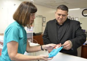 Winther shares Truth About Drugs booklets with a local business.
