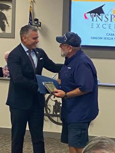 Congressman Juan Ciscomani presenting the award to David Leak