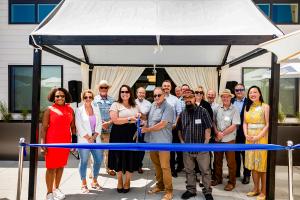 caritas homes affordable housing ribbon cutting photo
