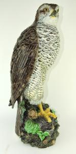 Hugo Lonitz majolica model of a hawk, created around 1875, with glass eyes, perched on a rocky ground with ferns and branches on an entwined branch base, 24 inches tall ($49,200).