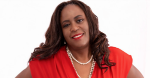 Beautiful Black woman wearing red dress; career, networking, career change, confidence coach