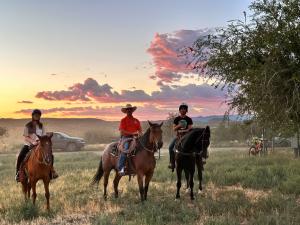 Students and faculty on horseback