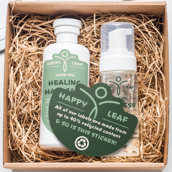 Eco-safe business card-style recyclable sticker inside a box with products.