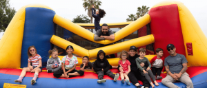 Instructors and students of AAMA on bounce house taking group photo