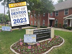 Aspen Healthcare's office in Lewisville, TX. Signs show Best of Denton County 2023 and We Honor Veterans.