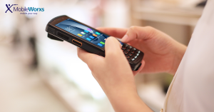 a handheld device shown in a person's hand close up