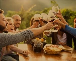 People enjoying wine at a winery