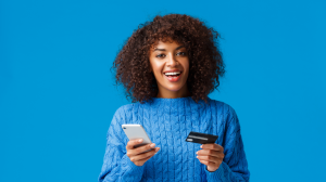 Peak Season 2023 EPaper Woman holding a phone and credit card for online shopping