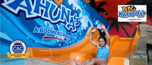 girl going down waterslide at Big Kahunas NJ with CAC badge and logo