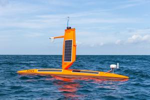 Saildrone Explorer SD 1045 sails under blue skies