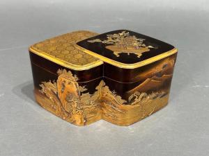 18th century Japanese lacquer incense box (kobako), shaped as a double-lozenge, a single tray inside the box, an exquisite example of Japanese lacquer artistry (est. $6,000-$9,000).