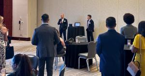 Paul Garibian, Co-Founder & CEO of Nota, and Scott Westheimer, President of The Florida Bar, stand side by side, showcasing the innovative Nota trust accounting software during a captivating event presentation in Fort Lauderdale, Florida.