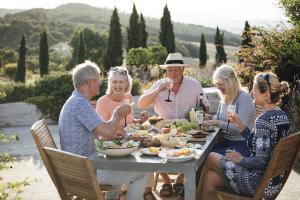 Image of senior citizen travelers having lunch in Italy