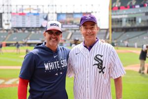 Chicago White Sox manager and Excelsior University alumnus Pedro Grifol (left) is joined at Guaranteed Rate Field by Excelsior University president David Schejbal (right) for Excelsior University Day on Sunday, Sept. 17, 2023