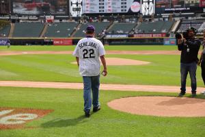 Excelsior University president David Schejbal approaches the pitcher's mound at Guaranteed Rate Field in Chicago to throw out the first pitch of Excelsior University Day on Sunday, Sept. 17, 2023