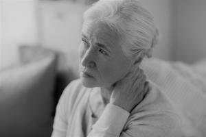 Senior woman with grey hair concerned about dementia