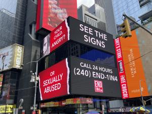 One of the END1IN4 "See The Signs & Act To End It" campaign billboards in Times Square NYC. "Your Child. Angry or Sexually Abused?"