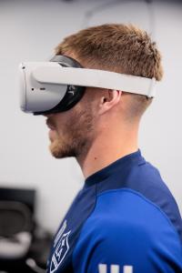 Tyler Boyd, a left winger with the LA Galaxy MLS team, wearing a virtual reality (VR) headset, using NeuroTrainer to prime his cognitive skills before a practice