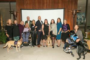 NSAM Inaugural Purple Poppy Awards and Fundraiser-Award winners, service dogs and handlers, and NSAM Board Members. Photo: Norm Levin