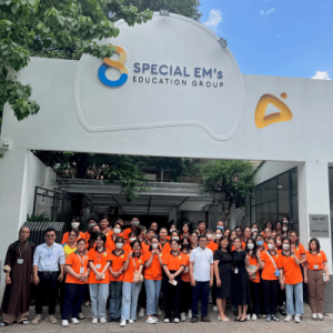 group photo of team outside the Special Em's center