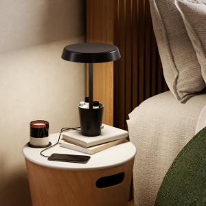 Image of the Cup Lamp, a versatile bedside lighting solution with integrated phone charging capabilities, offering both practicality and ambiance