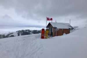 The image is a photo of the ski patrol shack at the summit of Soldier Mountain at the top Chair 2.