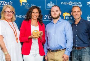 Four individuals standing at an award ceremony: Kate Wake Walker, Camilla Lunelli, William Smith, and Olly Wehring