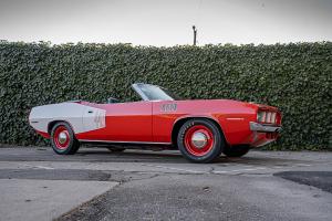 A convertible '71 Cuda in bright orange and white.