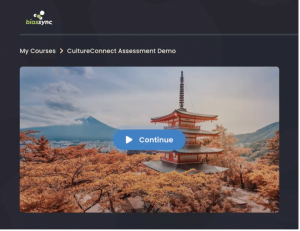 Imagine shows computer screen with "begin" button over a photo of showing a Japanese temple in the springtime with "BiasSync CultureConnect Assessment Demo" in the header, an example of what a user might see when taking BiasSync's new, proprietary Culture