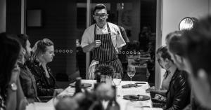 CHEFIN Private Chef Nick Guan serving a group of diners