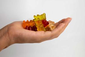 A hand holding delta 8 gummies