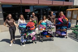 The team at Project Boon delivers backpacks to the Claremont Unified School District. One of many stops on their Backpack Drive.