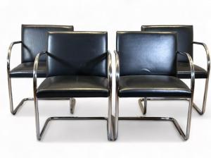 Four Brueton tubular chromed steel and leather armchairs, with square upholstered backs and seats on tubular chromed steel cantilevered bases, bearing Brueton tags (est. $800-$1,200).