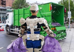 Waste collection worker wears exoskeleton