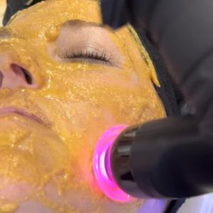 Glo2 Facial service with Glam customization pod, which is orange from 24 carat gold flakes as a main ingredient.