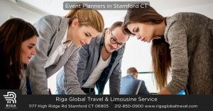 four event planners in Stamford CT leaning over table