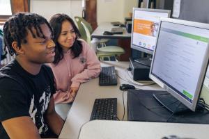 Students using Money Path on a computer