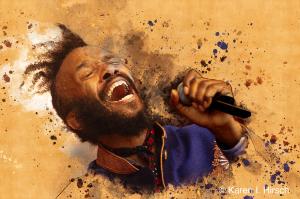 Portrait of Fantastic Negrito singing into his hand microphone with a orange painterly background  at the Chicago Blues Festival 2018