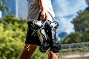 Carrying the Rollwalk eRW3 motorized shoes for a walk in the sun.ai powered electric shoes