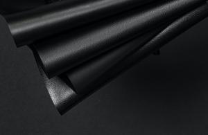 Four panels of black MIRUM® from NFW with multiple textures and finishes are arranged together.