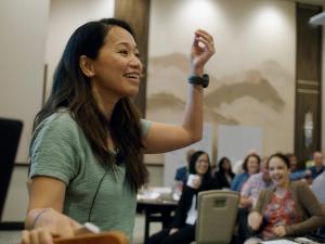 Storytelling Coach Esther Choy Leads A Storytelling Training For A Room Full Of Corporate Leaders