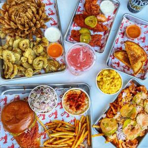 Overhead photo of menu items from Crimson Coward Nashville Hot Chicken Pomona, California