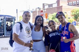 Don Armstrong and Charisha "Black Barbie" Bea at Children to Leaders Piston's Charity Basketball Game