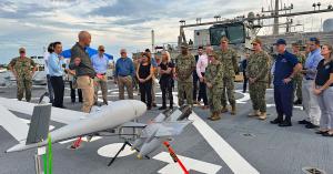 Vice Chief of Naval Operations Adm. Lisa Franchetti receives a briefing on PteroDynamics Transwing® UAV aboard the USNS Burlington